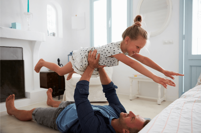 dad flying a daughter